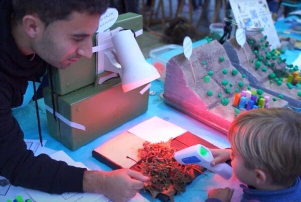 Researcher and children measuring temperature