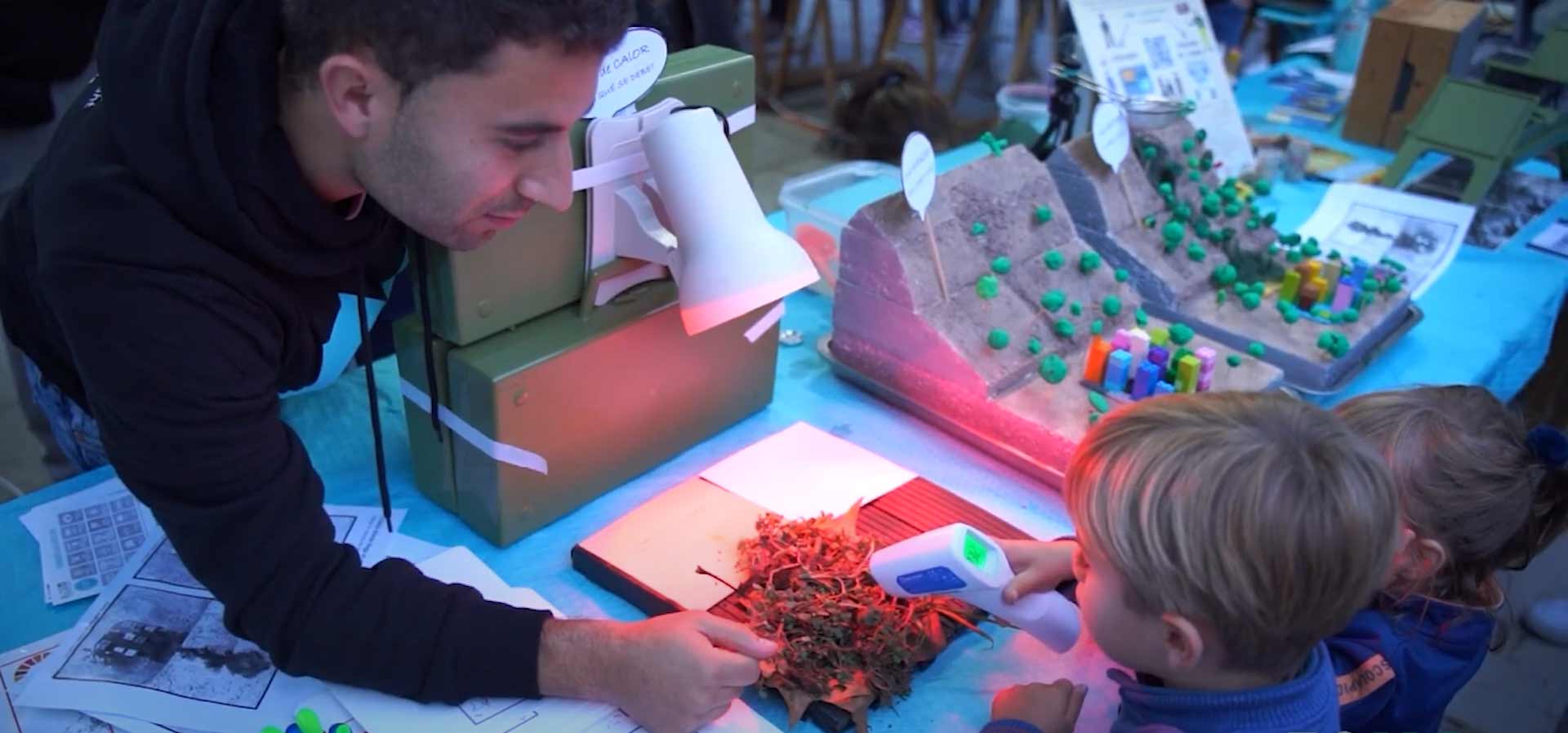 Researcher and children measuring temperature