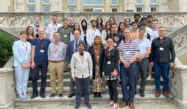 Group picture of the participants of the summer school, posing in front of the Magdalena Palace, in Spain