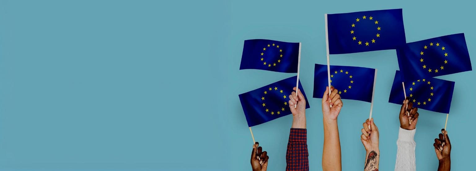 hands holding flags of the European Union